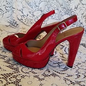 Stuart Weitzman Red open toe pumps.